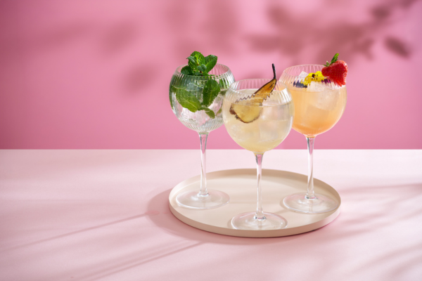 the spritzes on a tray in front of a pink background